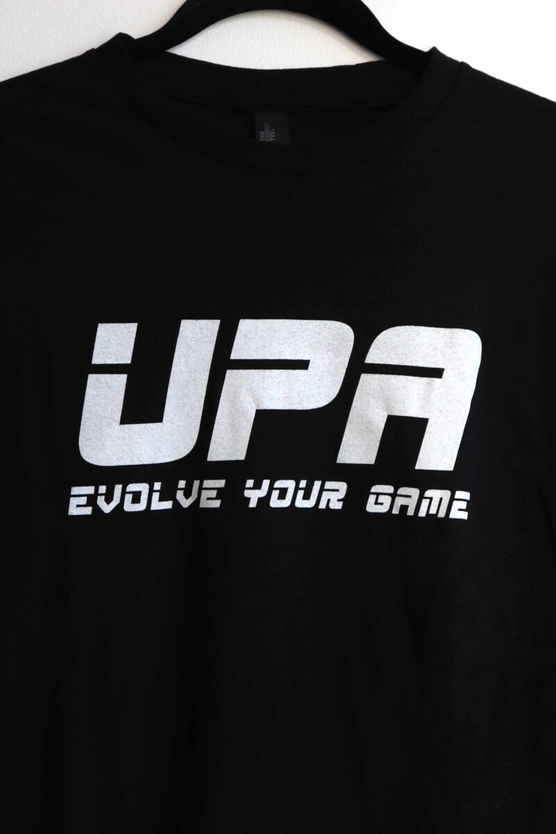 Showing the front of the Evolve Your Game - Unisex Concert Tee. UPA and Evolve your game in white text across chest