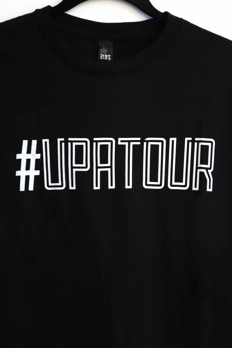 Shows front of #UPATOUR - Unisex Concert Tee. White text across chest